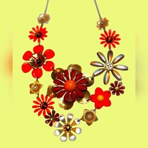 Retro style flower power necklace. Adjustable chain. Approximately 10 " long.
